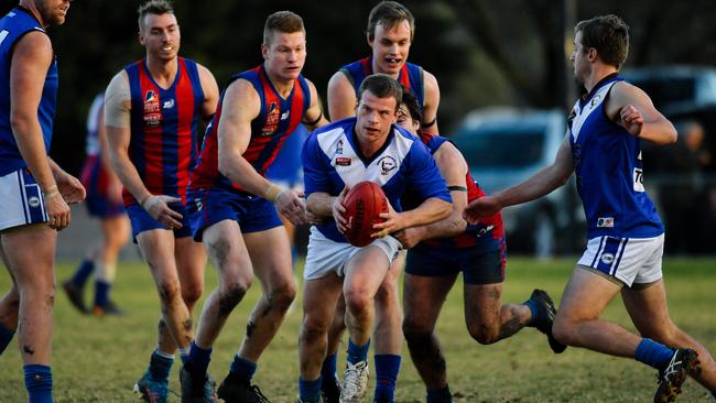 Kenilworth’s Nicholas Chesser evades his Hope Valley opponents. Picture: AAP/Morgan Sette