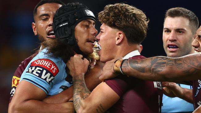 BRISBANE, AUSTRALIA - JUNE 21:  Jarome Luai of the Blues and Reece Walsh of the Maroons scuffle during game two of the State of Origin series between the Queensland Maroons and the New South Wales Blues at Suncorp Stadium on June 21, 2023 in Brisbane, Australia. (Photo by Chris Hyde/Getty Images)