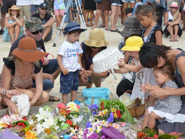 Mourners gather at Shelly Beach today. Photo: Brian Pamphilon