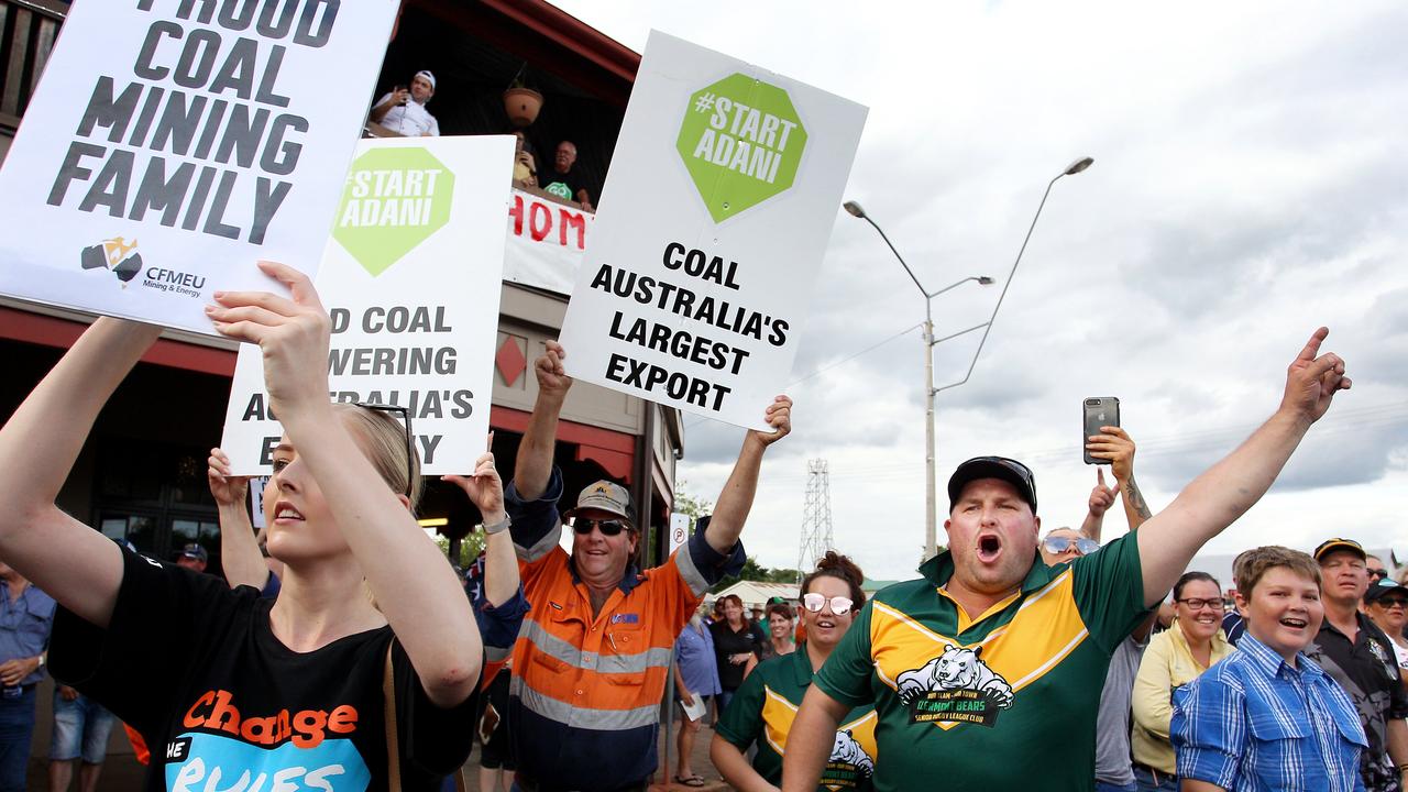 Locals and pro-Adani supporters gather outside the Commercial Hotel to protest against anti-Adani environment activists in Clermont, in April 2019. Picture: Lisa Maree Williams/Getty Images