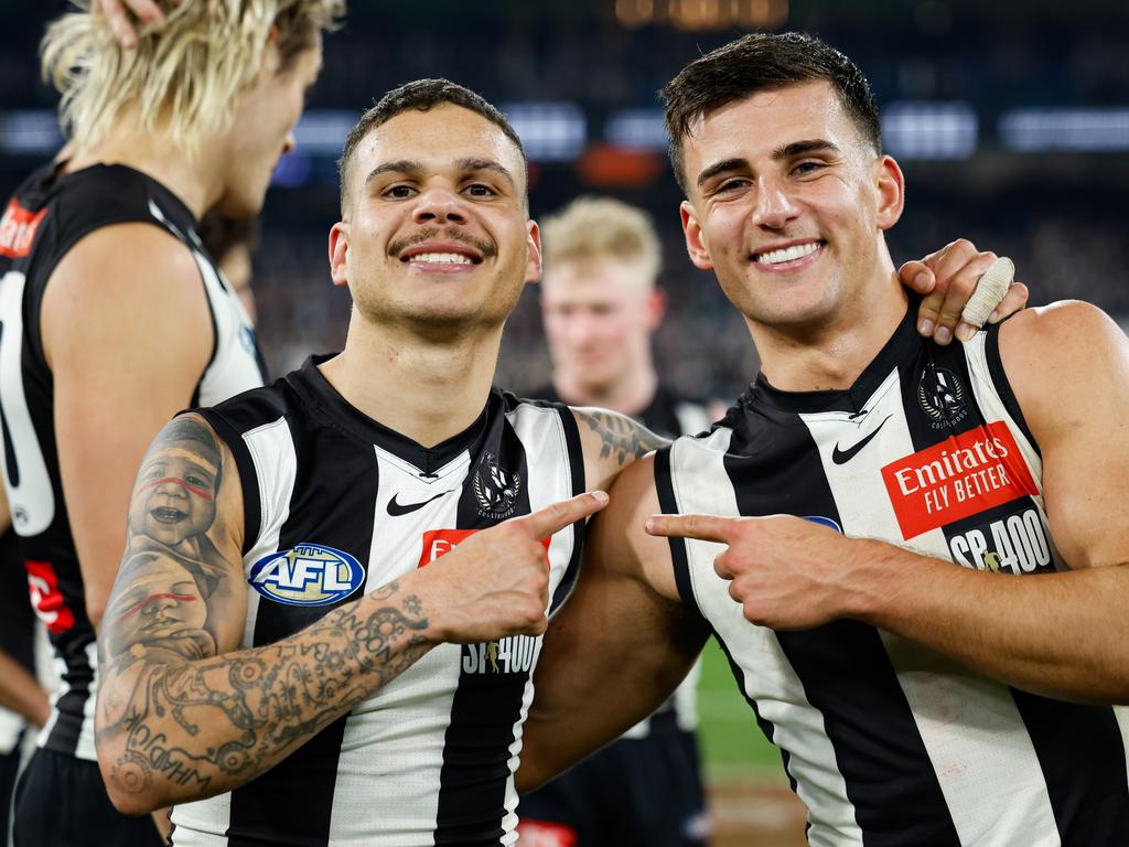 Bobby Hill and Nick Daicos after the win over Collingwood. Picture: Dylan Burns/AFL Photos via Getty Images.