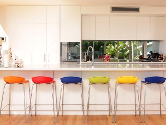 Coloured kitchen stools inspired by a Greeny Purvis painting. Picture: John Fotiadis