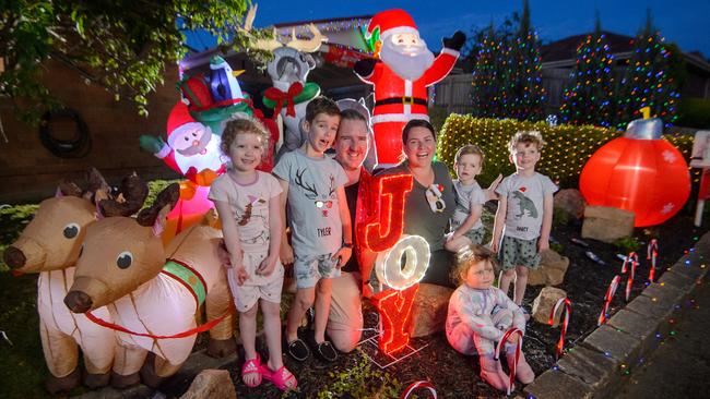 Brett and Melissa Morgan with their kids Tyler, 7, Cassidy, 5, Darcy, 4, and Blake, 2, with their neighbour Zoey, 3, at their Rowville home, Picture: Jay Town