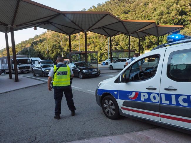 French police officers control vehicles coming across the border from Spain near Le Perthus, southern France following two quick-succession, separate attacks in Barcelona and Cambrils. Picture: AFP