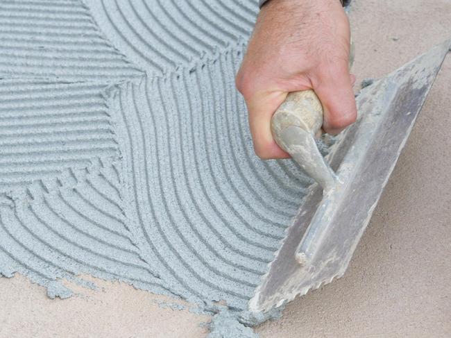 HOME - DIY stone pebbles part 2 with Joe Bagnara - laying pebbles and grouting - step 4 spread ceramic tile adhesive with a notched trowel