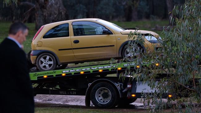 Police remove the suspects’ car.