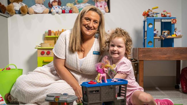 Play therapist Belinda Dean working with 4-year-old Bonnie Schram as part of the trial. Picture: Brad Fleet