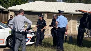 Police guarding the scene of a fatal dog attack at Milton Street, Maryborough.