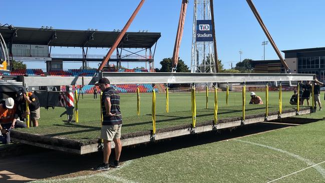 The drop in cricket pitch being installed at TIO Stadium. Picture: Max Hatzoglou