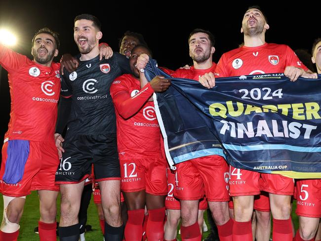 MELBOURNE, AUSTRALIA - AUGUST 27: Hume City celebrate with the flag after winning the 2024 Australia Cup Round of 16 match between Hume City and FC Melbourne Srbija at Hume City Stadium, on August 27, 2024 in Melbourne, Australia. (Photo by Daniel Pockett/Getty Images)