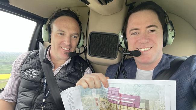 David Collard, right, exploring Geelong by chopper.