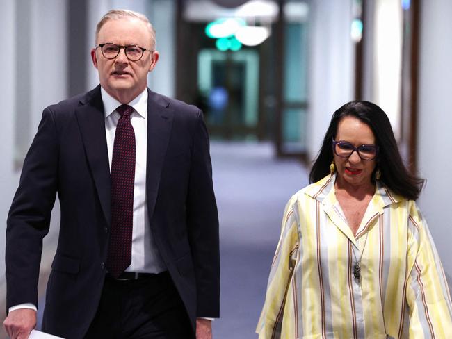 Australia's Prime Minister Anthony Albanese (L) and Minister for Indigenous Australians Linda Burney walk to a media conference at Parliament House in Canberra on October 14, 2023. Australians have roundly rejected greater rights for Indigenous citizens, scuppering plans to amend the country's 122-year-old constitution after a divisive and racially-tinged referendum campaign. (Photo by DAVID GRAY / AFP)