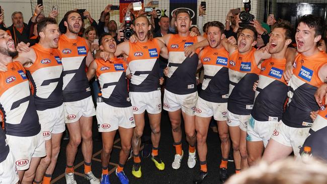 GWS players sing the club song after winning during the Second Preliminary Final match between the Collingwood Magpies and the GWS Giants during in Week 3 of the AFL Finals Series at the MCG in Melbourne, Saturday, September 21, 2019. (AAP Image/Michael Dodge) NO ARCHIVING, EDITORIAL USE ONLY