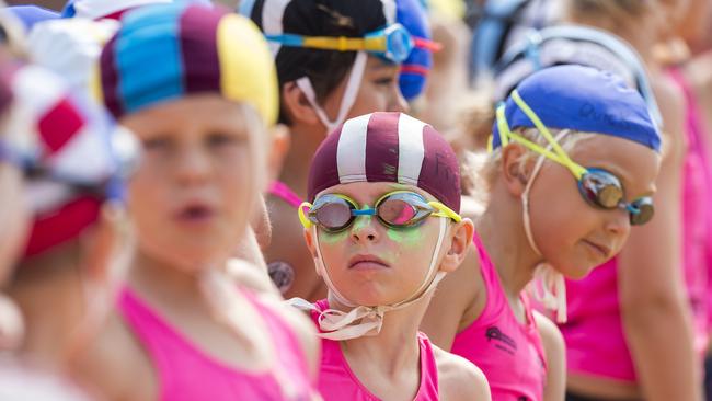 Competitors on the starting line before the under-9 girls surf race at the Surf Life Saving Central Coast junior branch carnival at Copacabana Beach. Picture: Troy Snook