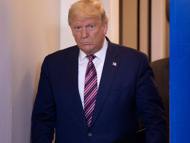 TOPSHOT - US President Donald Trump arrives to speak in the Brady Briefing Room at the White House in Washington, DC on November 5, 2020. - Democrat Joe Biden is leading President Donald Trump in the race for the 270 electoral votes that will put one of them over the top, with the Democrat's campaign asserting they believe he has enough votes to win in key battleground states that remain undecided, like Pennsylvania. (Photo by Brendan Smialowski / AFP)