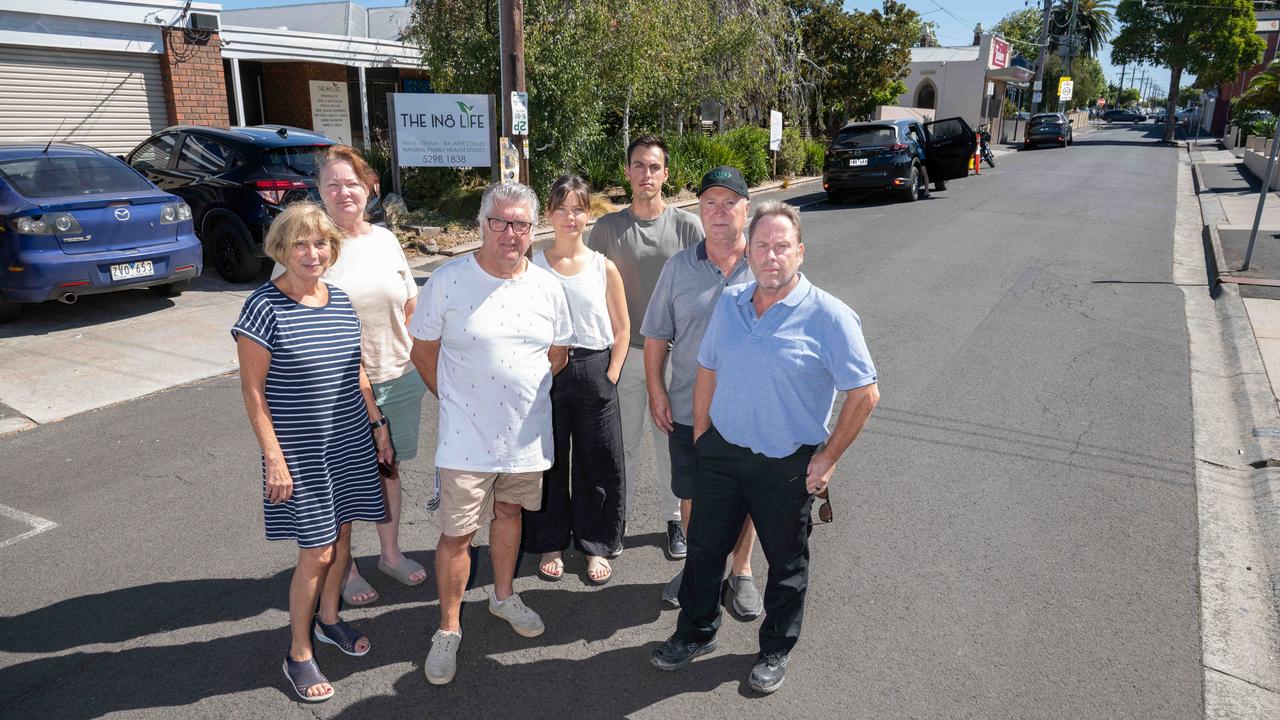Angela Dinaro, Larissa Jones, Chris Morton, Dr Lydia Davis, Dr Zachary Trajkovski, Dean Hope and Shane Pearce in front of the proposed Hope St apartment buildings that they are campaigning against. Picture: Brad Fleet