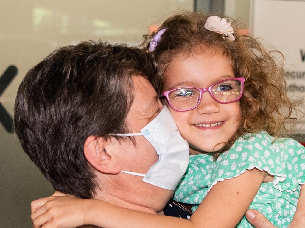 Julianna Nemeth hugs her grand daughter Lili Kaity, 5, and Brisbane International airport as borders re-open. Picture: Brad Fleet