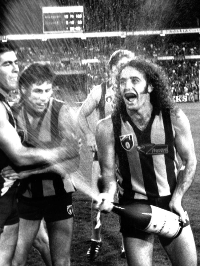 John Platten celebrates with champagne. at Waverley Park after the 1992 Foster’s Cup Grand Final between Hawthorn and Fitzroy.