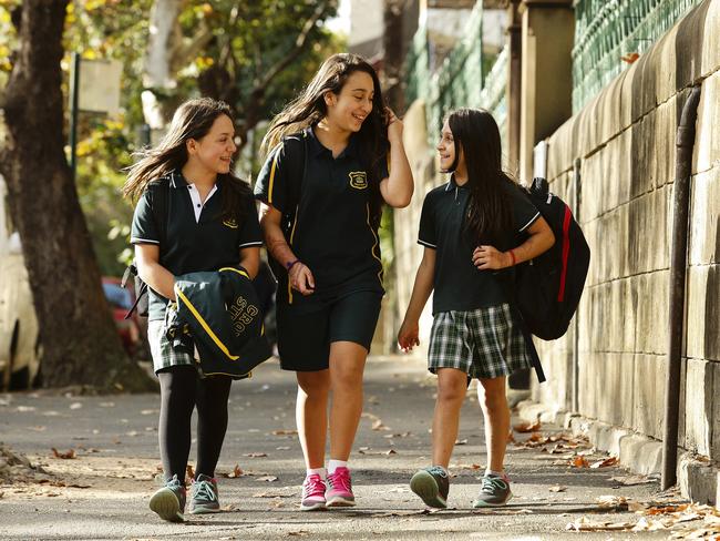 The Radic sisters — Isabella, 10, Stephanie, 11, and Thalia, 9 — leaving Crown St Public School, Surry Hills, yesterday. Picture: Justin Lloyd