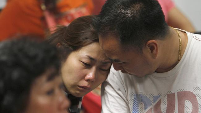 A relative of the passengers of AirAsia flight QZ8501 weeps as she waits for the latest news on the missing jetliner at a crisis centre set up by local authority at Juanda International Airport in Surabaya, East Java, Indonesia.