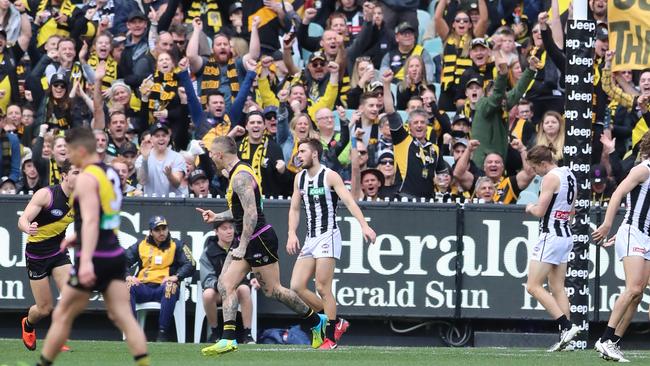 Dustin Martin celebrates a goal to the roar of Tigers fans. Picture: Alex Coppel