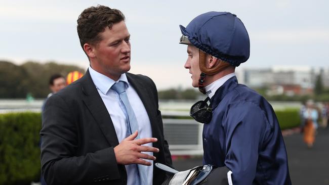 Chad Schofield speaks with assistant trainer Ben Elam after the win. Picture: Jeremy Ng/Getty Images