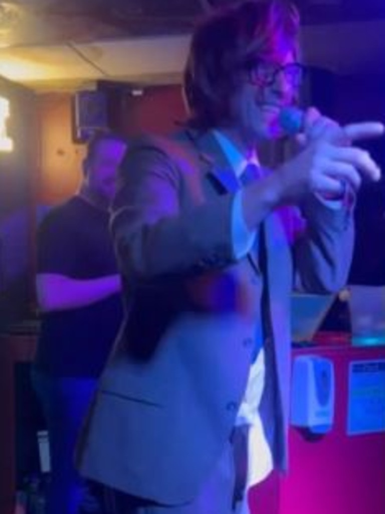 Chris Martin performing in disguise at a Vegas karaoke bar.