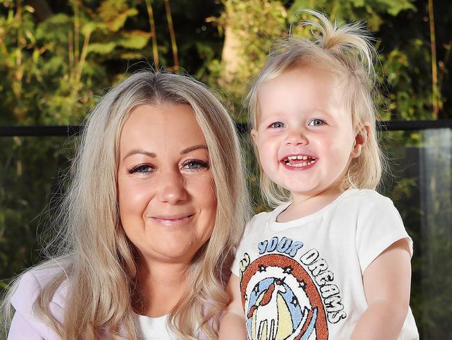 Nicole Shepherd with her daughter Scarlett 2. The case study for this story is Nicole Shepherd from Mornington in Melbourne. The 41 year old mother of two  is undergoing a hysterectomy this week to prevent ovarian cancer. She had a genetic test which showed she had Lynch Syndrome genes that predispose her to bowel, ovarian and breast cancer.Only one insurer would offer her any cover, they charge her double the regular premium and exempted her from cover for ANY cancer not just the cancers she is at risk from. This is despite the fact she is having two yearly colonoscopies and mammograms and preventive surgery. Picture Rebecca Michael.
