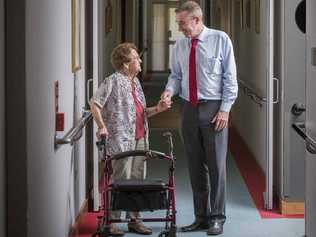 FOLLOW ME: Elsie McFarlane leads Member for Page Kevin Hogan around the Dougherty Villa aged care facility after he announced 56 more places, including 20 at Dougherty Villa. PHOTO: ADAM HOURIGAN