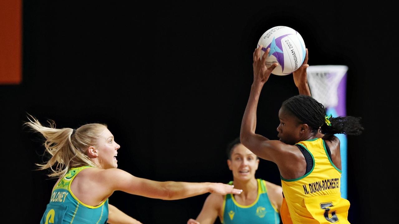 Nicole Dixon-Rochester of Team Jamaica (R) holds the ball away from Kate Moloney