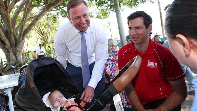 Mr Miles andMr Smith visit the River Cruz Cafe in Bundaberg where they met six-month-old Eden Armatage. Picture: Adam Head