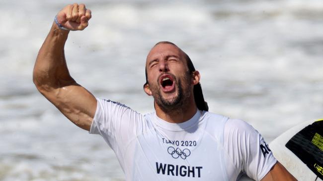 Australia's Owen Wright celebrates after winning the men's Surfing bronze medal final at the Tsurigasaki Surfing Beach, in Chiba, on July 27, 2021 during the Tokyo 2020 Olympic Games. (Photo by Yuki IWAMURA / AFP)