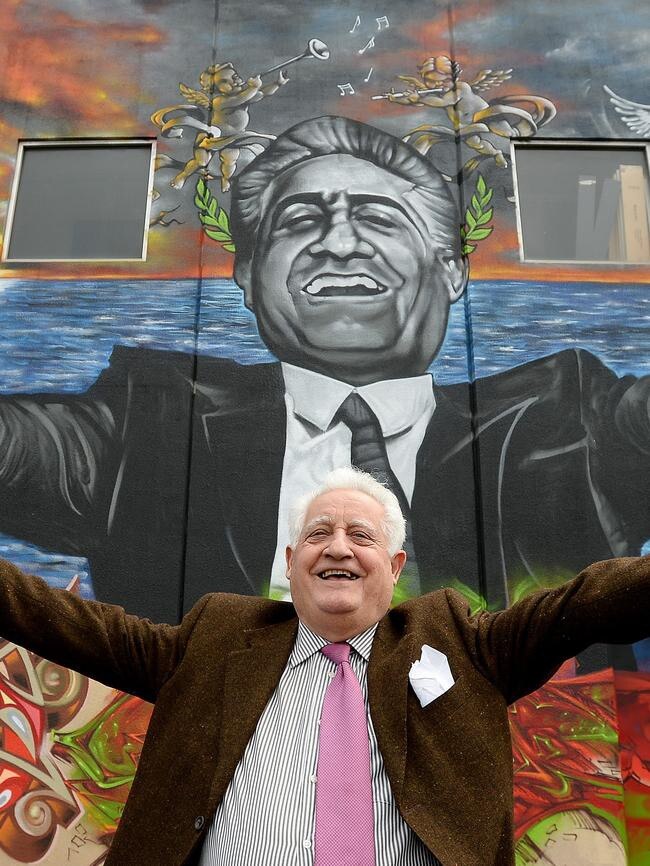 The man himself in front of his mural.