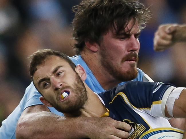 Nic White of ACT if tackled by Kane Douglas of NSW. NSW Waratahs Vs ACT Brumbies Saturday 28th June 2014. Pic: Mitch Cameron