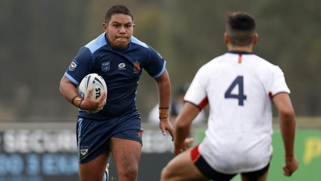 Jerome Goddard of CHS looks to break through the CIS defence. Picture: Jonathan Ng