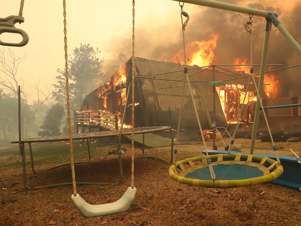 House is lost to the fire on Hassall rd, Bruxton. Bushfire surrounds the town of Buxton in the Southern Highlands as Rural Fire Service work to protect as many homes as they can. Picture: Rohan Kelly