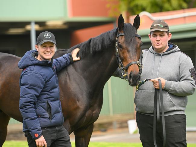 MELBOURNE, AUSTRALIA - OCTOBER 11: Trainer Ben Hayes and strapper William Evans pose with Mr Brightside during a media opportunity at Lindsay Park Stables, Flemington Racecourse on October 11, 2024 in Melbourne, Australia. (Photo by Vince Caligiuri/Getty Images)