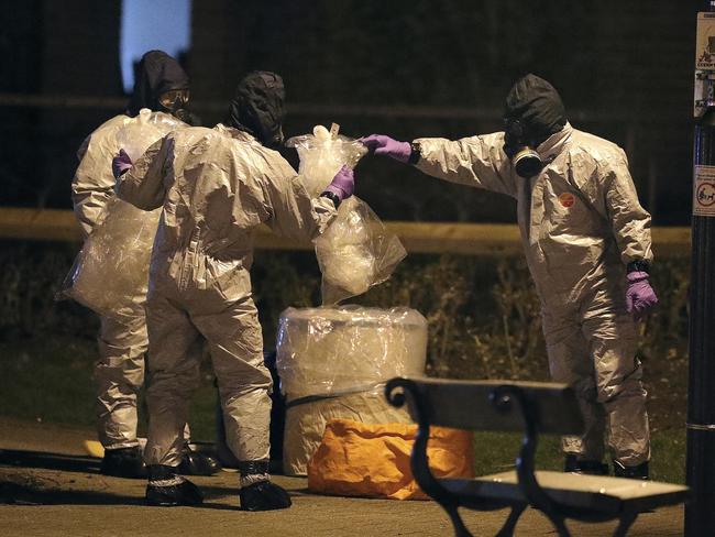 Investigators in protective suits work at the scene in the Maltings shopping centre in Salisbury, England, where Mr Skripal and his daughter collapsed. Picture: Andrew Matthews/PA/AP