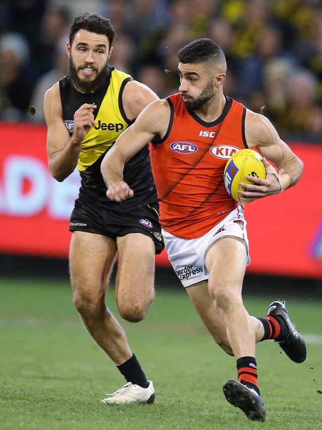 Adam Saad charges away from Richmond’s Shane Edwards. Picture: Michael Klein