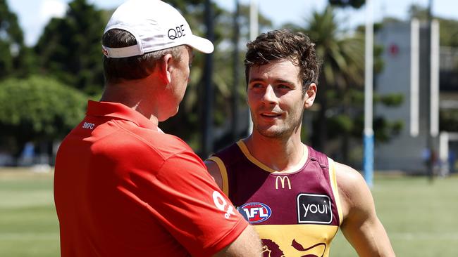 Brisbane recruit Josh Dunkley catches up with Swans coach John Longmire. Picture: Phil Hillyard