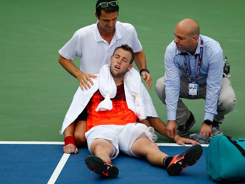 Jack Sock of the United States receives assistance for heat exhaustion at the 2015 US Open. Picture: Al Bello/Getty Images