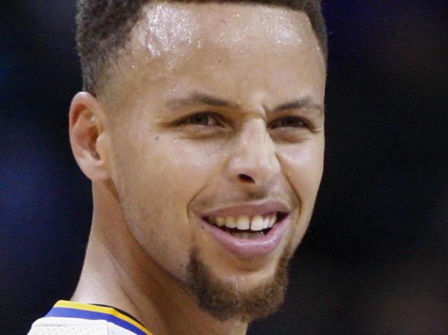 Golden State Warriors guard Stephen Curry reacts to an official's call as his team plays the Charlotte Hornets in the first half of an NBA basketball game Wednesday, Dec. 2, 2015, in Charlotte, N.C. (AP Photo/Nell Redmond)