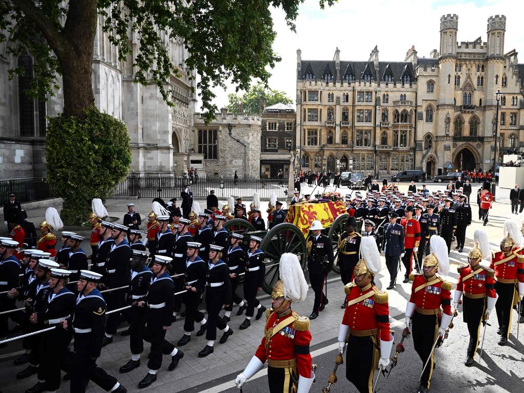 Royal Navy Sailors walk ahead and behind the coffin of Queen Elizabeth II. Picture: AFP