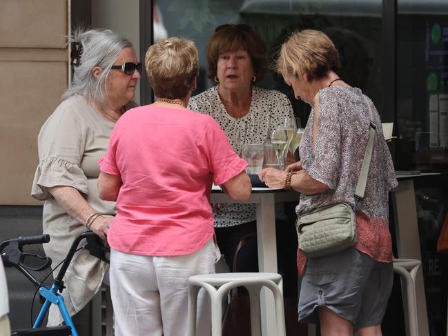 The family of Clare Nowland celebrate a ‘bittersweet’ victory at a pub on Elizabeh Street. Picture: Rohan Kelly