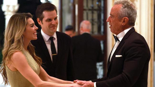 Robert Kennedy Jr, right, talks with Matt Gaetz and his wife Ginger Luckey Gaetz at Mar-a-Lago in Florida last week. Picture: Getty Images