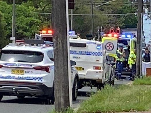 Emergency crews work on the cyclist at the scene. Picture: Jo Seymour