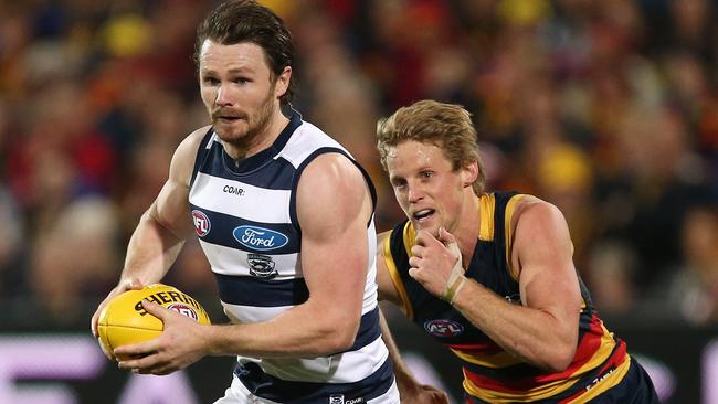 Patrick Dangerfiel is tackled by Crow Rory Sloane. Picture: James Elsby (AFL Media/Getty Images)