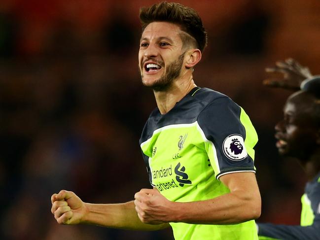 MIDDLESBROUGH, ENGLAND - DECEMBER 14: Adam Lallana of Liverpol (L) celebrates scoring his sides first goal with Sadio Mane of Liverpool (R) during the Premier League match between Middlesbrough and Liverpool at Riverside Stadium on December 14, 2016 in Middlesbrough, England. (Photo by Jan Kruger/Getty Images)