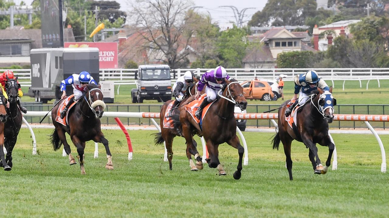 Sunsets (right) holds off Riff Rocket (purple, white silks) and Gates (blue cap with white polka dots) to win the Neds Classic at Caulfield Racecourse on October 21. Picture: Reg Ryan / Racing Photos