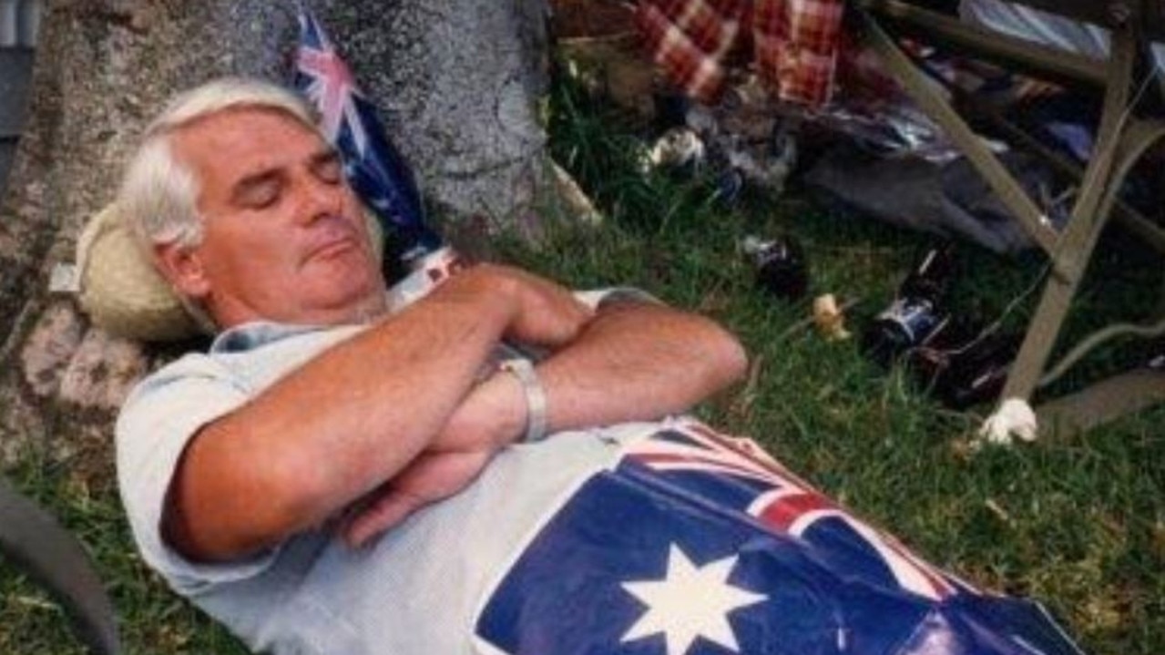 A party-goer relaxing under a paper flag at Mrs Macquarie’s Chair, Australia Day 1988.